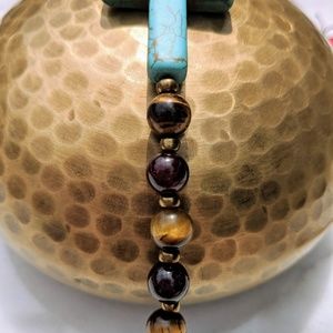 Blue cross bracelet tiger eye and garnet
